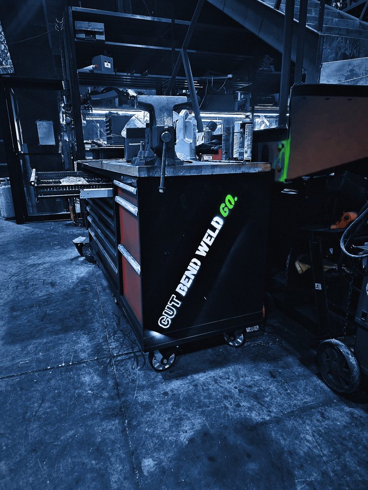 The logo sprayed on the end of a rolling toolbox under the vise