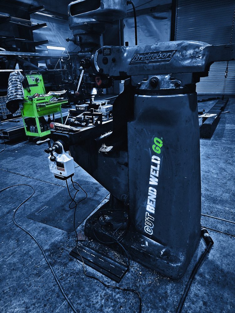 The logo sprayed up the column of the Bridgeport mill