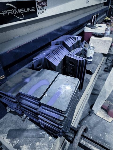 Stacks of formed plates on the press brake
