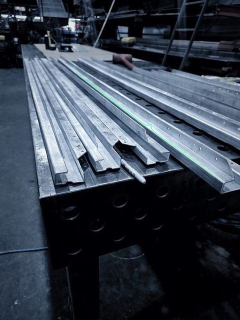 Long formed channels running the length of the fixture table