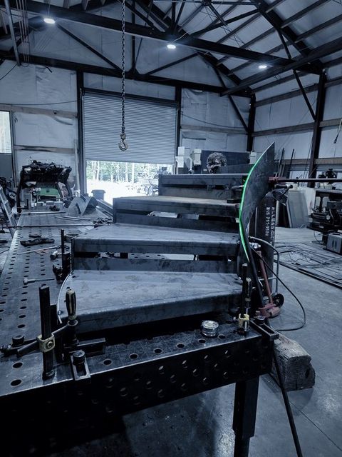Steel treads fitted to a curved stair on the fixture table